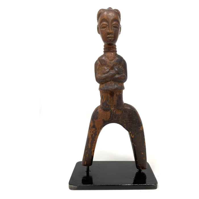 Baule-Style Female Figural Sling Shot from Ivory Coast mounted on Custom Black Metal Stand.