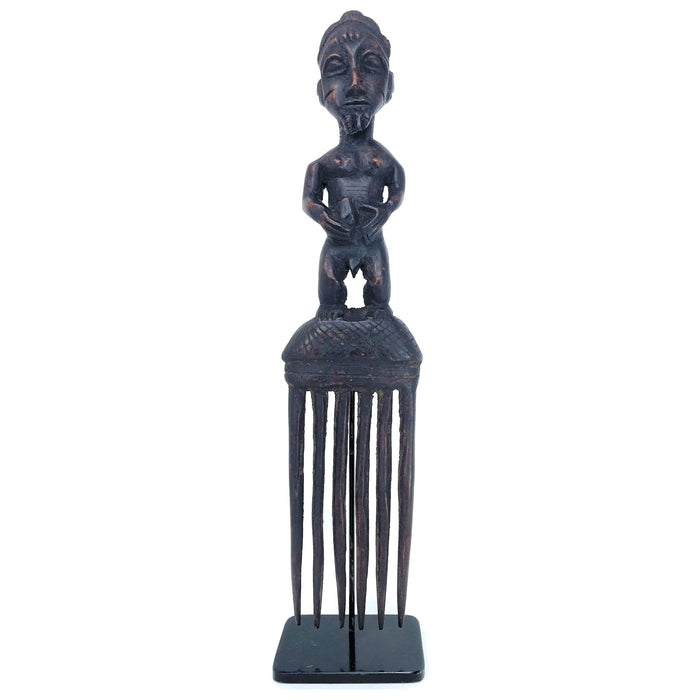 Baule Comb with Hand-Carved Male Figure from Ivory Coast mounted on Black Metal Stand. 