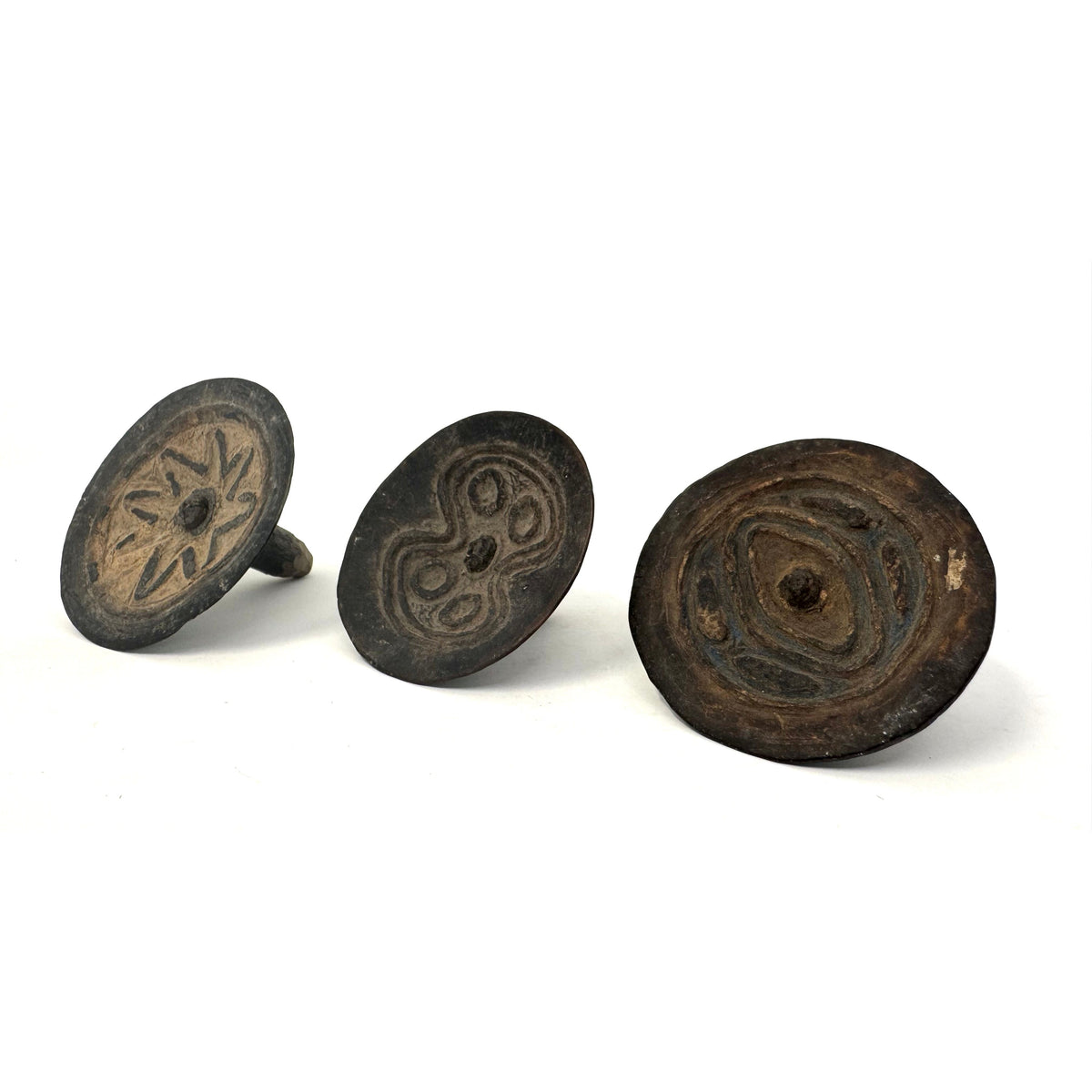 Set of Three Abelam Coconut Shell Tops/Children's Toys with Incised Designs and Acrylic Stand from Papua New Guinea (PNG)