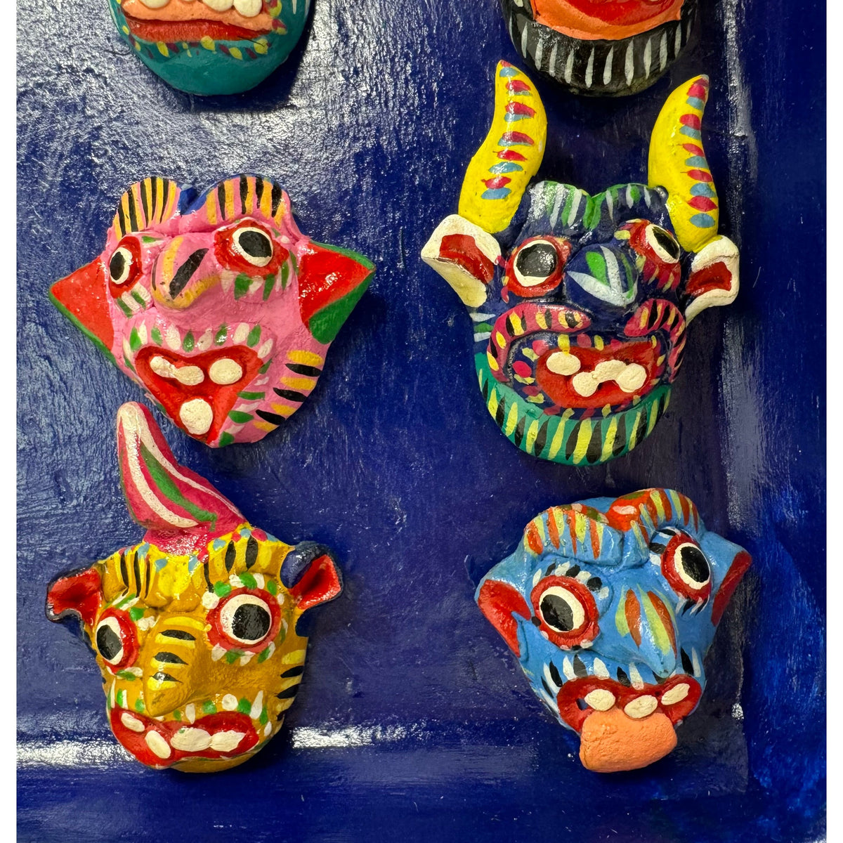 Ortega Family Folk Art Display Plaque of 16 Minature Masks from Mexico - 9.5" H X 8.75" W X 1.38" D