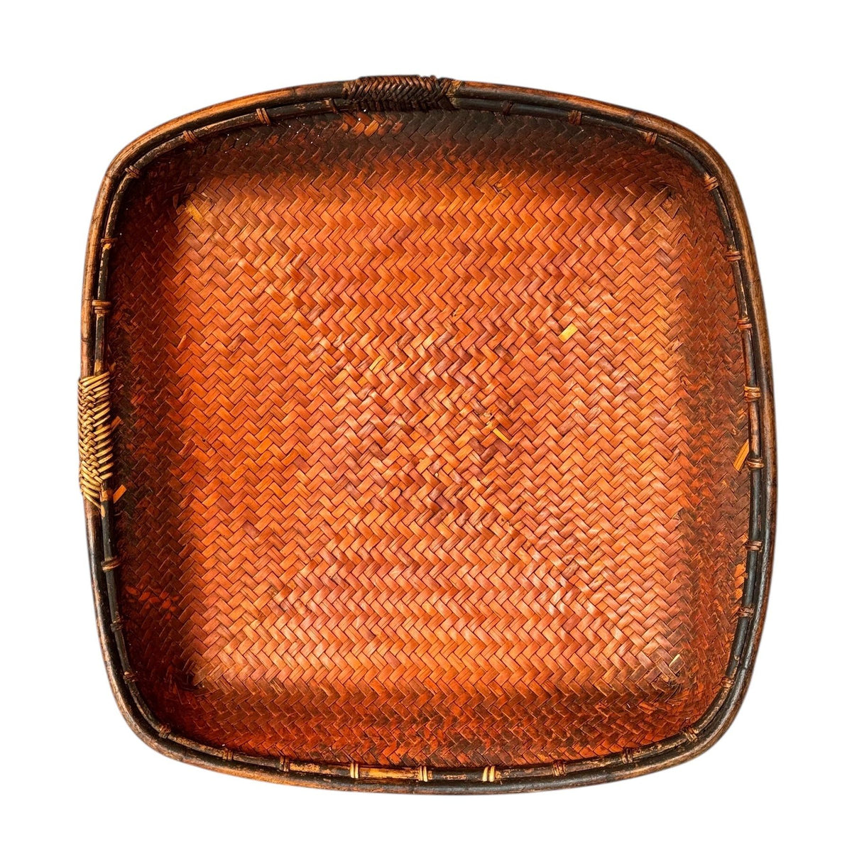 Woven rectangular tray with a brown finish on a white background