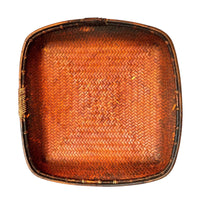 Woven rectangular tray with a brown finish on a white background