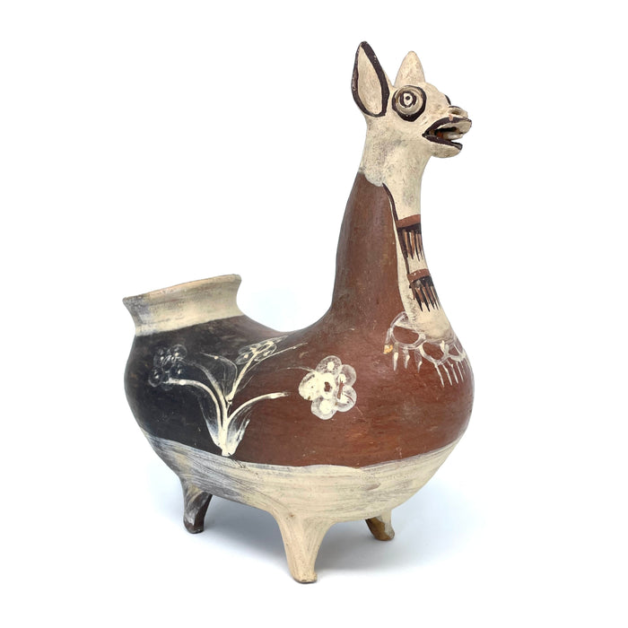 1960s ceramic figurine of a llama from Peru, painted in brown and beige tones, with decorative patterns.