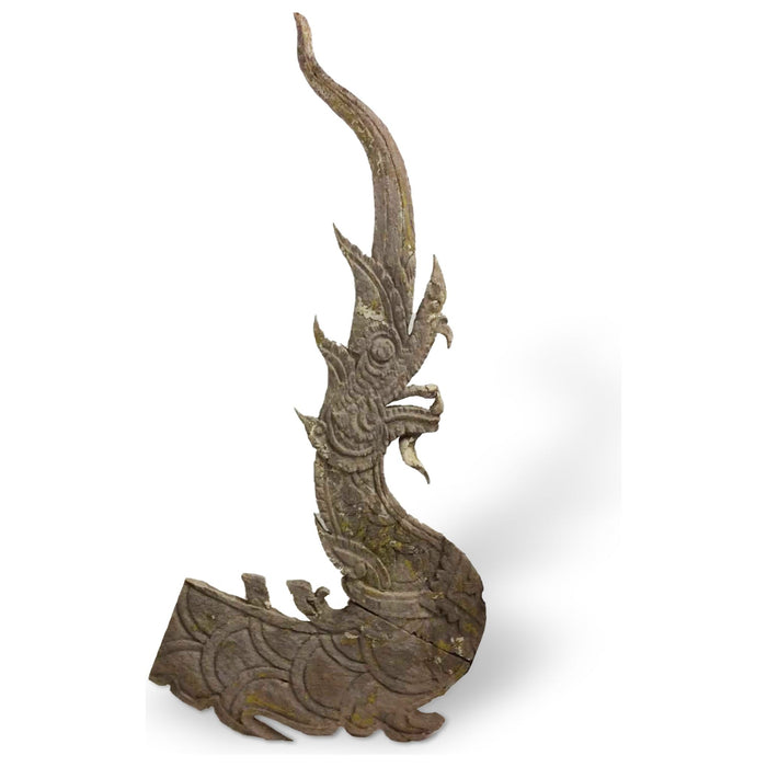 An antique Thai wooden temple dragon sculpture with a Naga head, displaying natural patina and intricate handwork, measuring 49 inches in height and 24 inches in width.
