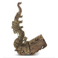 Antique 1800s Thai wooden temple dragon architectural element with intricate carvings and a natural patina.