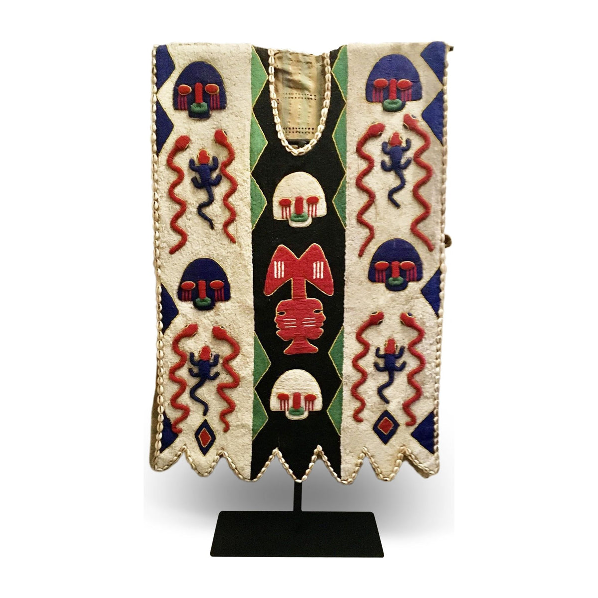 1950s Yoruba ceremonial beaded tunic with animal motifs and abstract patterns, displayed on a metal stand.